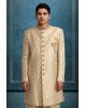 Golden Ivory Sherwani, Embellishment Set On The Neckline And Buttons. Paired Up With Raw Silk Fused Dhoti Pant