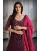 Dark wine colour pure fabric gown with heavy threadwork  with majentha pink dupatta