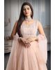 Pastel peach mirror work net gown with exquisite detailing on yoke and dupatta in same colour