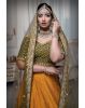 Mustard green and yellow silk lehenga