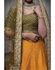 Mustard green and yellow silk lehenga