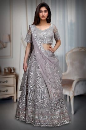 Lavender Net Lehenga With Exquisite Threadwork And Detailing Throughout The Lehenga