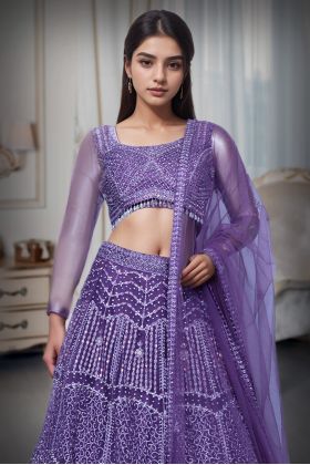 Regal Purple Net Lehenga With Stone Work Details And Raindrop Beads Detailing In Waist Line With Same Color Dupatta