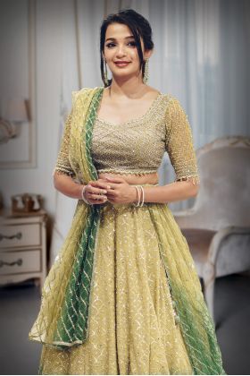 Metallic Green Heavy Embellished Bridal Lehenga With Golden Stone Details On Skirt , Crop Top And Dupatta