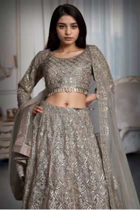 Metallic Golden Heavy Stone Worked Net Lehenga With Heavy Detailed Crop Top And Same Color Dupatta