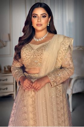 Beige colour Lehanga with Pinkish Tone , Heavy stone and Bead worked Skirt and Tops with Hanging Drops along with the Dhuppatta