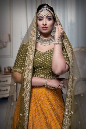 Mustard green and yellow silk lehenga